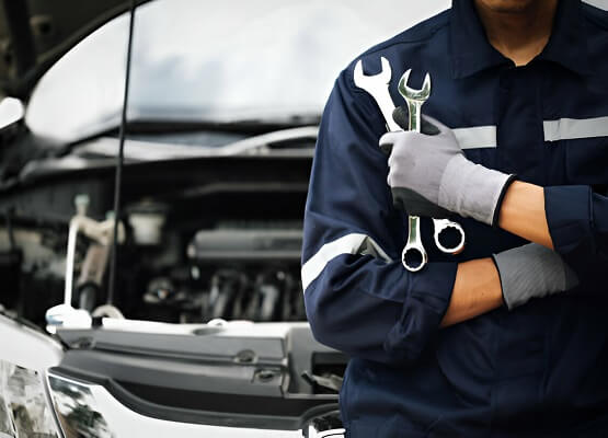 Car Mechanic Holding Wrench