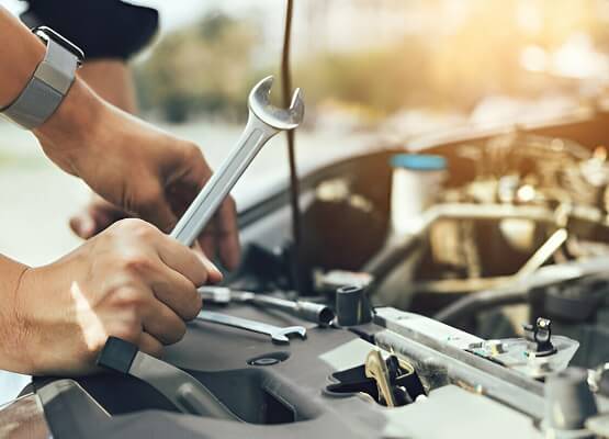 Technician Checking Engine And Maintenance